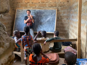 Teaching guitar to the students