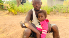 Abu cares for his two year old sister