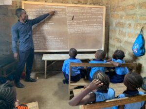 SHARP Teacher in Sierra Leone teaching children