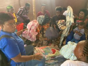 Sorting clothing distributed to flood victims in Freetown Sierra Leone